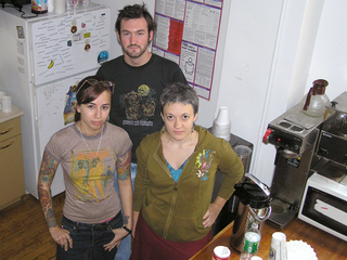 Helping Hearts staffers and their new coffee-maker; recent fund-raising will pay for its repair.